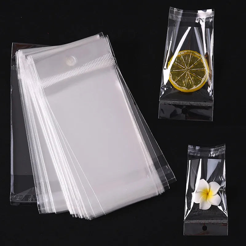 100 transparent plastic hanging self-adhesive bags, OPP self sealing bags, jewelry candy bags, gift biscuit sales bags - Sun Studio